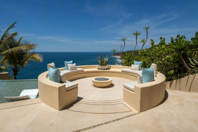 Ocean-view terrace pictured in the retreat property gallery.