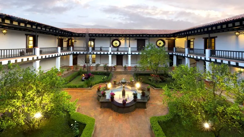 Interior courtyard with seating, plants and arcaded walkways