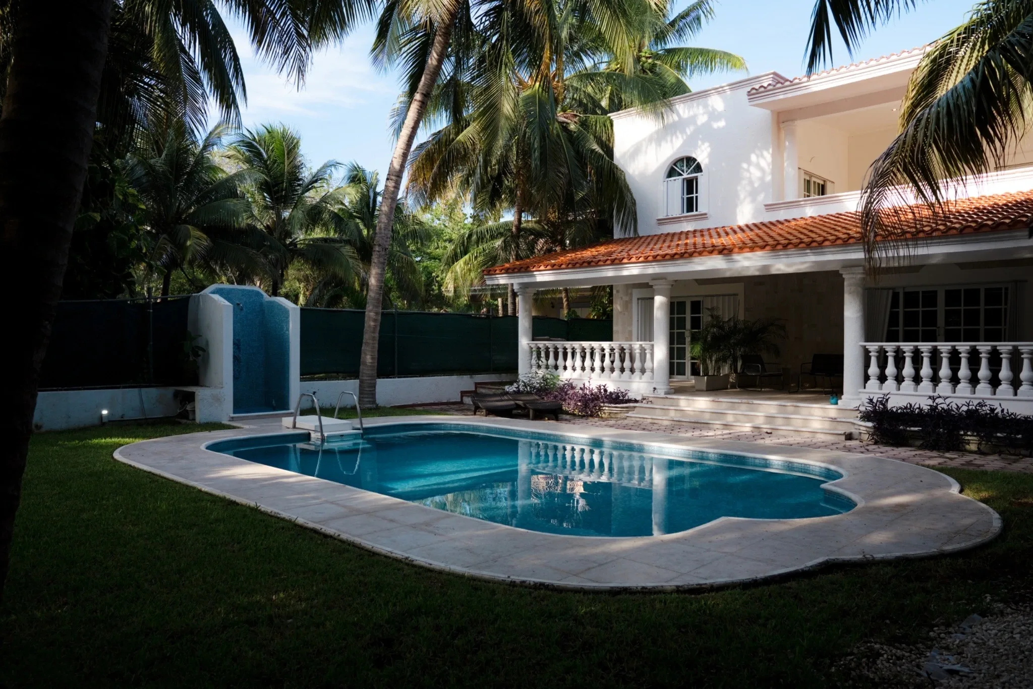 Pool and residential exterior at Ibogaine Clinic.