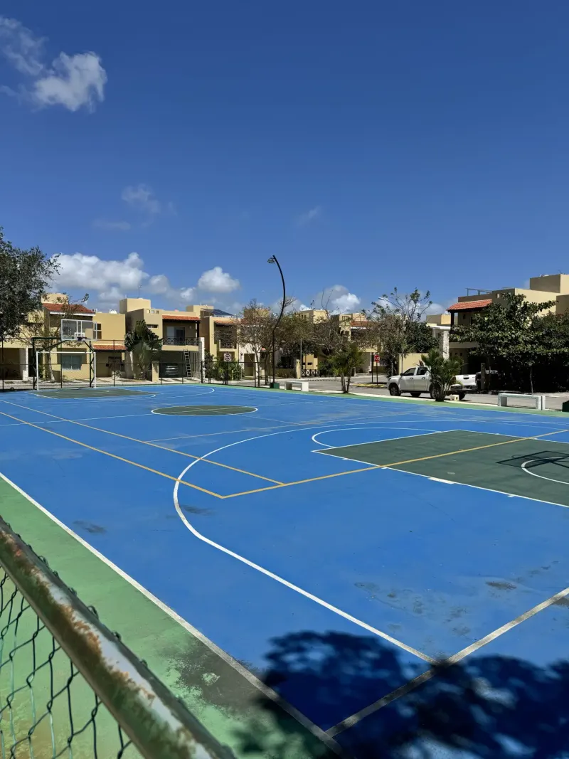 Sports court shown with Zamá accommodation amenities.
