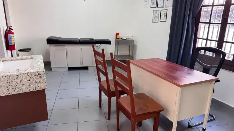 Medical office with an exam table and a desk