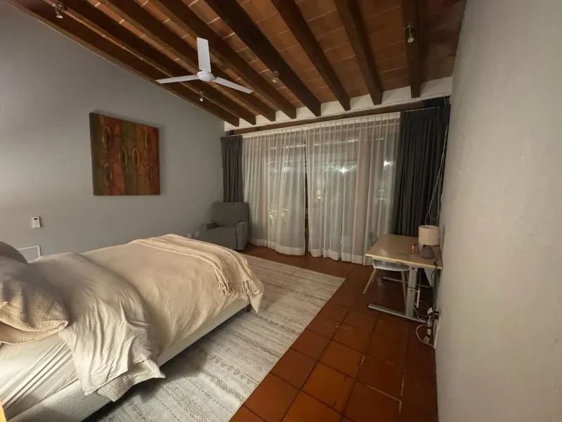 Guest bedroom and terrace doors at Inner Realms Center.
