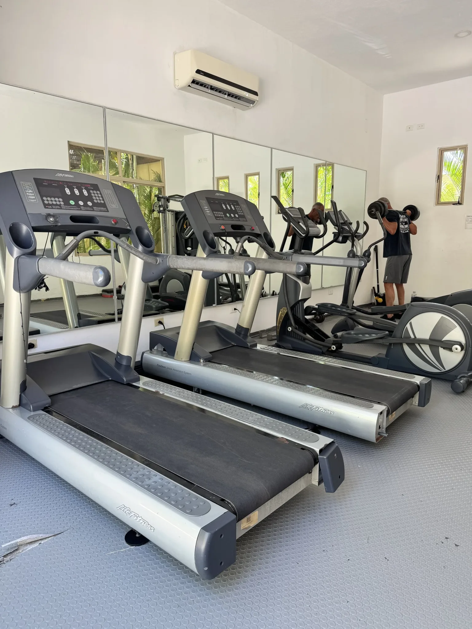 Fitness area shown with Zamá accommodation amenities.
