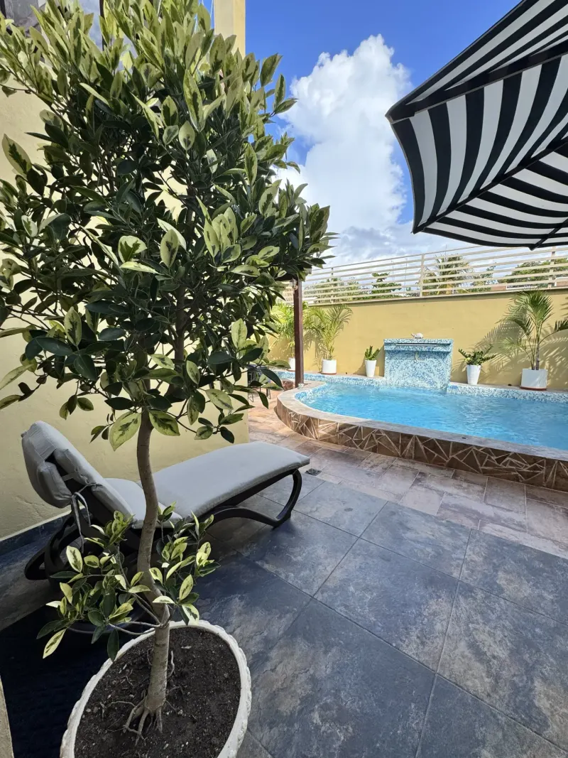 Pool and outdoor seating at Zamá.