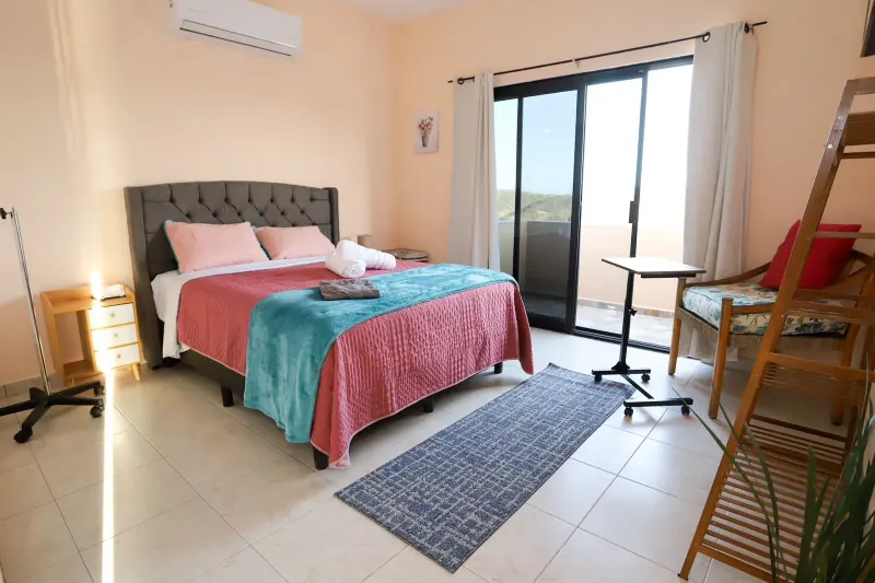 Bedroom with garden view at Viraha.