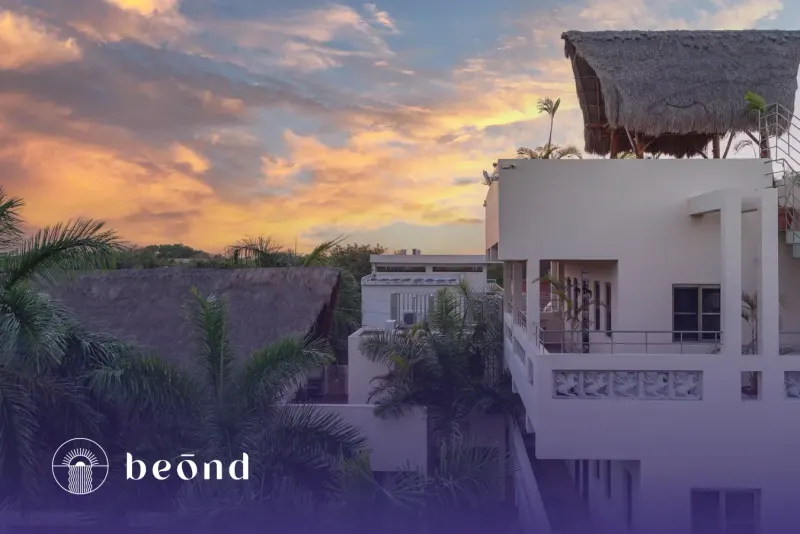 Beond residential exterior at sunset.