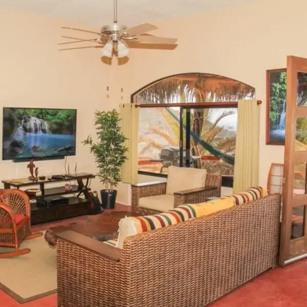 Empty shared living room with seating and television
