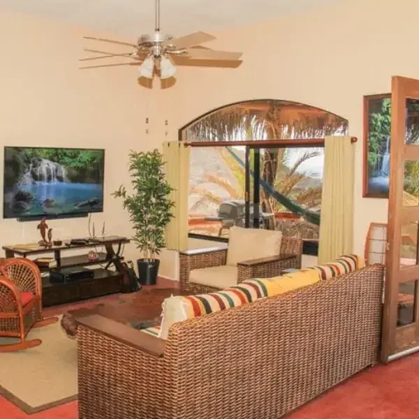 Empty shared living room with seating and television