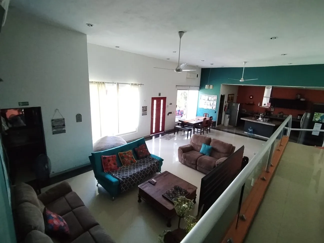 Shared living room, dining table and kitchen viewed from above