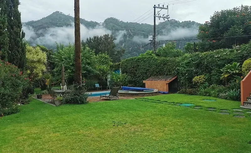 Garden and pool in the Tepoztlán mountain setting at IbogaQuest.