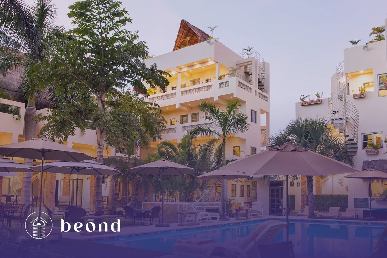 Beond residential buildings and pool.