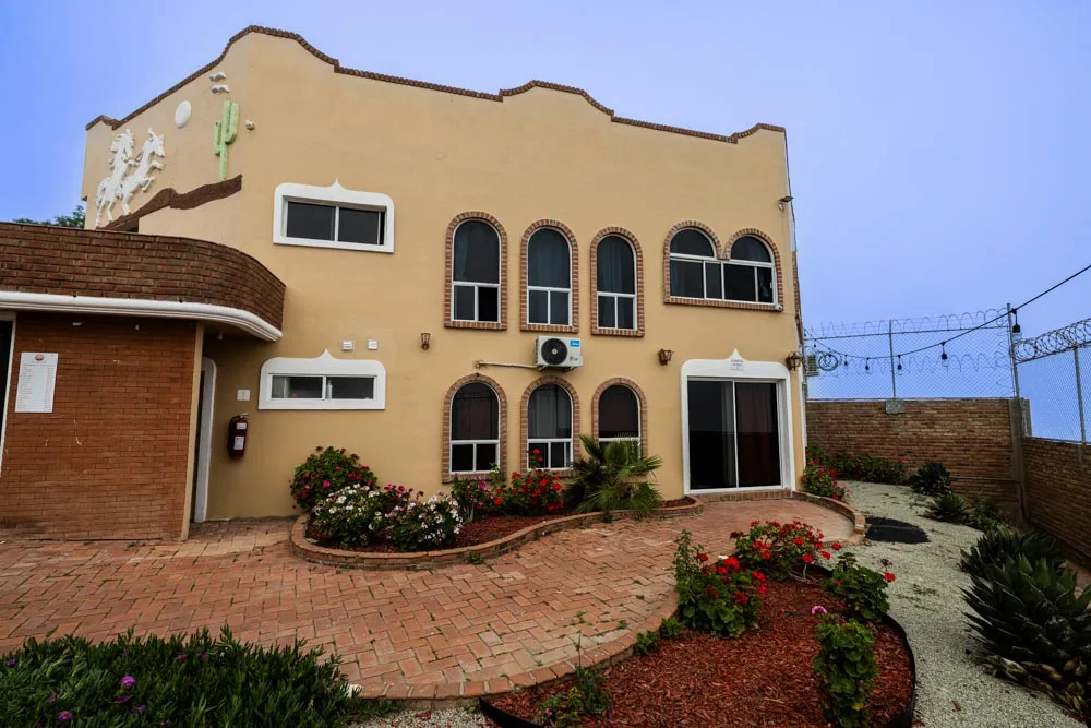Courtyard and arched windows on a Baja Rehab residential building