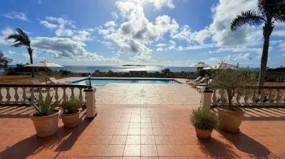 Ocean-facing terrace and pool shown at Casa Santa Isabel.