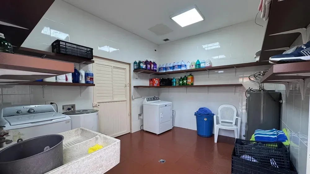 Laundry room with a washer, a dryer and shelves