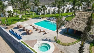 Pool and landscaped grounds viewed from above at Oceánica